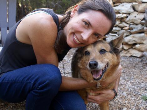 Ashley hugging a happy Cayenne the dog