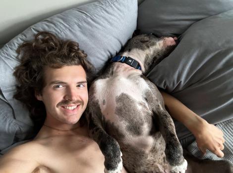 Tanner the man lying next to Tanner the dog