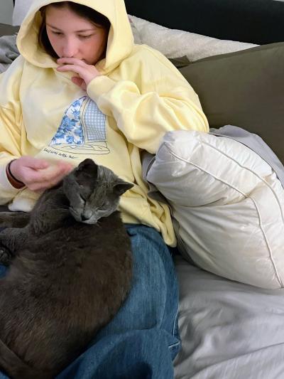  Lucky the cat in a person's lap at home